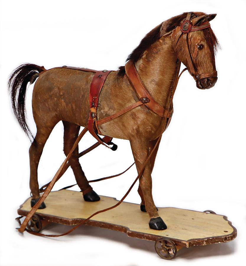 horse on casting wheels with spokes, around 1890, pelt (1 of 1)