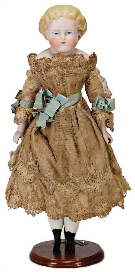 Parian, bisque porcelain shoulder headed doll, 38 cm,: Parian, bisque porcelain shoulder headed doll, 38 cm, modelled hair, blue painted eyes, closed mouth, fabric body, bisque arms and legs, with up-painted boots, clothes old or sewed of old fabric Germa