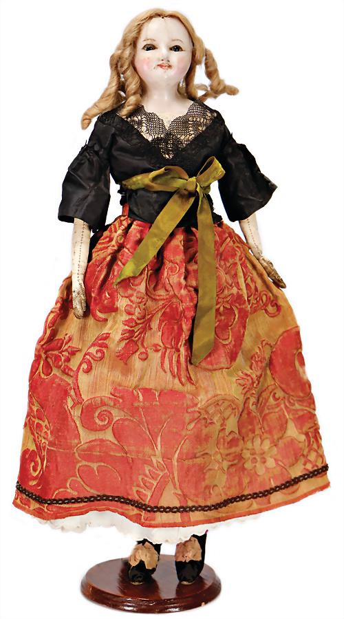 wax coated papier mâché shoulder headed doll, England,: wax coated papier mâché shoulder headed doll, England, 1880, 52 cm, brown glass eyeswithout pupil , stucking sleepy eyes, mohair wig, fabric body, leather forearms, cracks in face, tip of the nose i