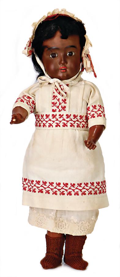 SCHÖNAU & HOFFMEISTER 1906, bisque socket head, fix: SCHÖNAU & HOFFMEISTER 1906, bisque socket head, fix inset brown glass eyes, dark colored jointed body with fix wrists, mohair wig, old clothes, 1 finger is knocked, collection Katz German D