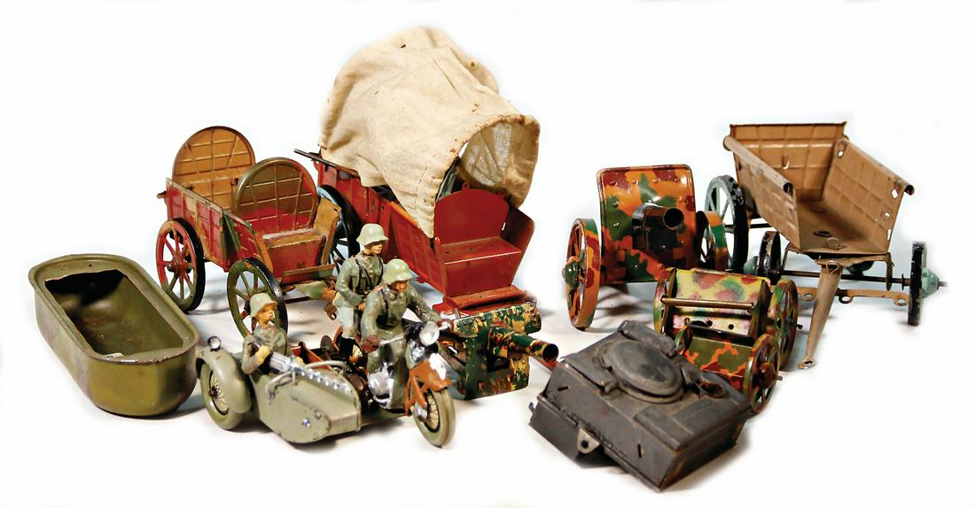 mixed lot of  tin toy, covered wagons, cannons, field (1 of 1)