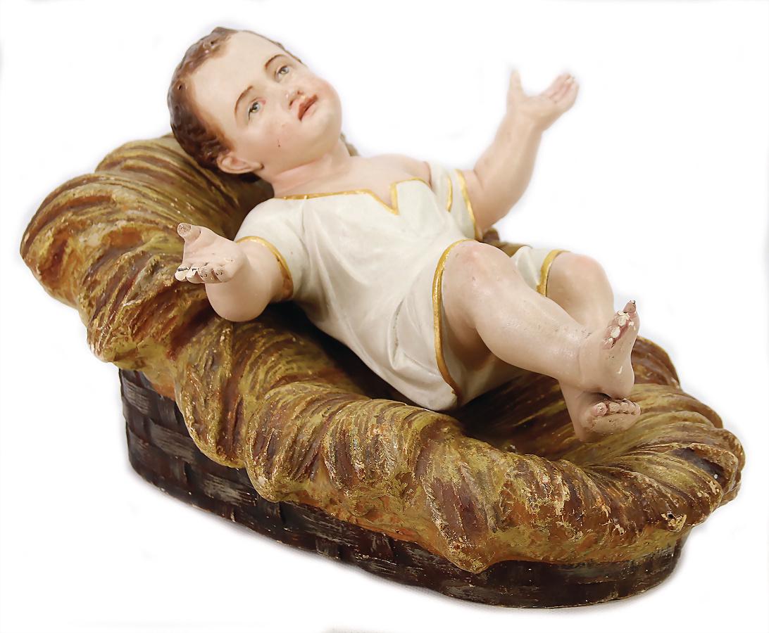 Jesuskind, Masse, 33 cm, Finger u. 2 Zehen etwas: Jesuskind, Masse, 33 cm, Finger u. 2 Zehen etwas bestoßen, mit Stroh-Krippe