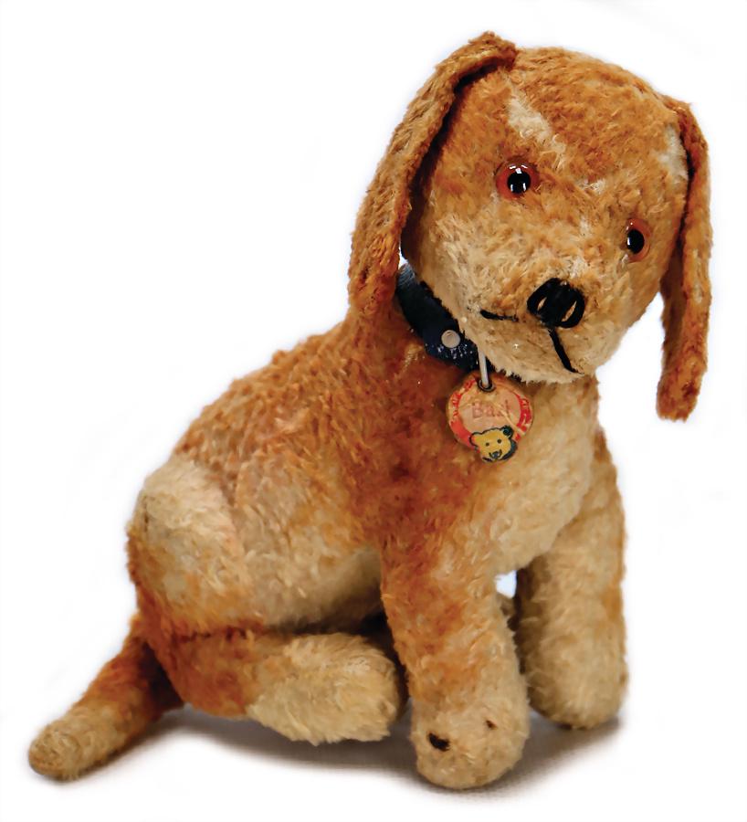 STEIFF Bazi, dog, syntetic silk plush, with chest: STEIFF Bazi, dog, syntetic silk plush, with chest label, chest label is worn, without button, used, small places with pelt loss, 1 foot with a small place with a visible wire, otherwise good German De
