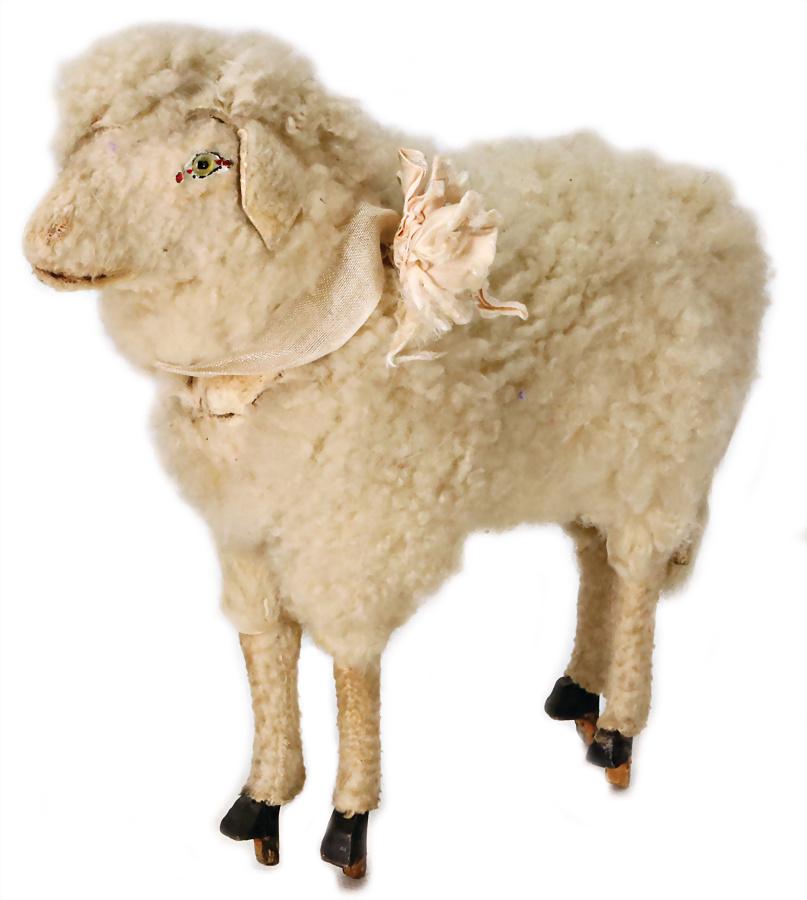 lamb, green glass eyes, 1 eye missing, genuine lambskin: lamb, green glass eyes, 1 eye missing, genuine lambskin on wood hooves, decorative, height: 24 cm, lenght: 26 cm, decorative German Description Lamm, grüne Glasaugen, 1 Auge fehlt, echtes Lammfell au