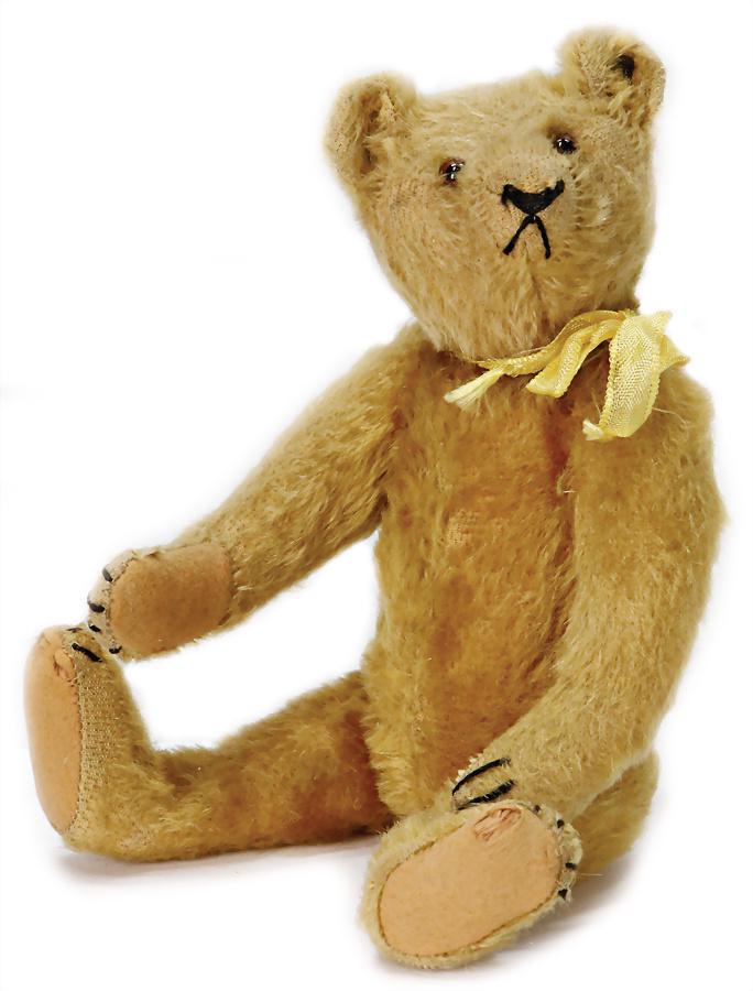 STEIFF bear, around 1926, blond mohair, with button,: STEIFF bear, around 1926, blond mohair, with button, block letters, long stretched F, glass eyes, embroidering at snout and single places in face are worn, and mohair loss, faults at the felt paws, lo