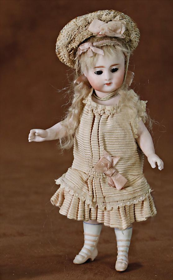 all-bisque doll, 18.5 cm, brown sleepy eyes, closed mouth, jointed arms and  legs, modelled boots (1 of 3)
