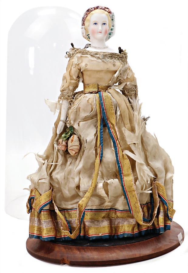 exceptional bisque porcelain shoulder headed doll, full head, elaborately produced, enameled: exceptional bisque porcelain shoulder headed doll, full head, elaborately produced, enameled hairnet, with feather ornaments and veil, blue painted eyes, closed mouth, bisque forearms, bisque shoes an