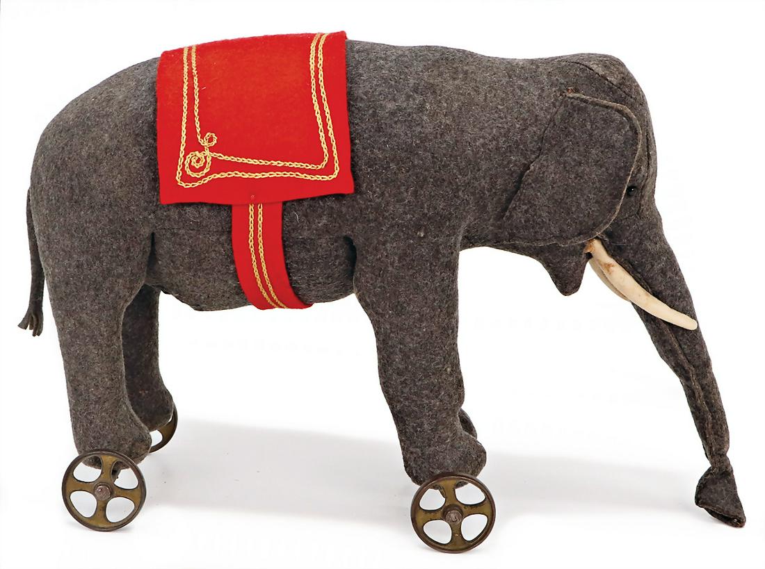 STEIFF early elephant on casting wheels with spokes, with button, block letters, long trailing f, (1 of 5)