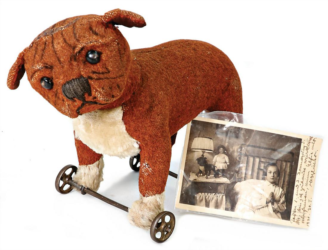 STEIFF Bulldog, produced 1908-13, on metal wheels, short plush, brown, standing, big shoe button (1 of 3)