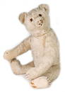 STEIFF early bear, around 1930, originally white mohair, a bit covered in dust, with button, block