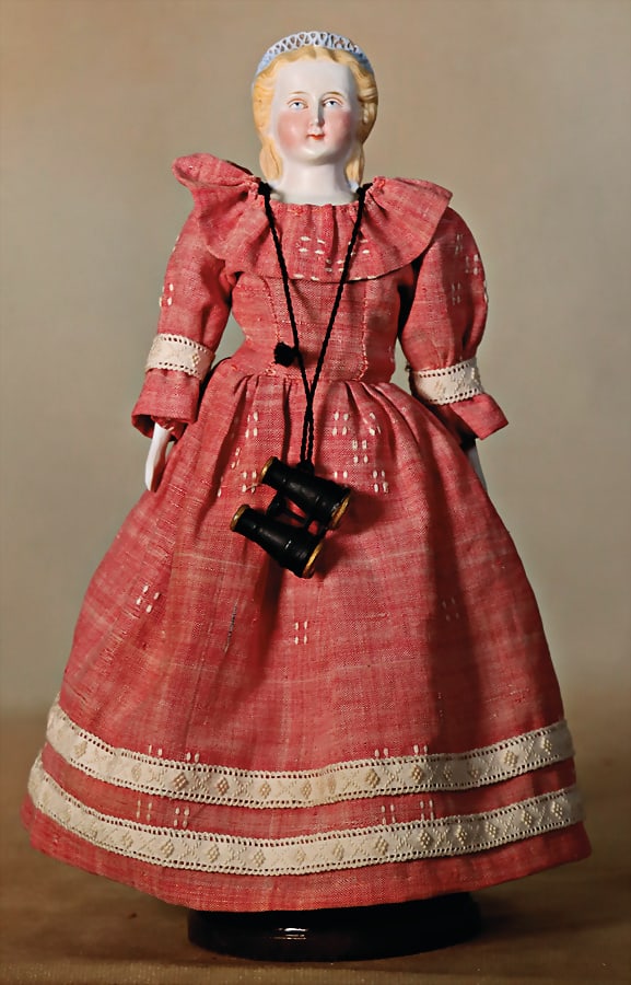 Parian, bisque porcelain shoulder headed doll, 23.5 cm, blue painted eyes, closed mouth, modelled: Parian, bisque porcelain shoulder headed doll, 23.5 cm, blue painted eyes, closed mouth, modelled hair, modelled hood, fabric body, bisque arms and legs German Description Parian, Biskuit-Porzellan-Br