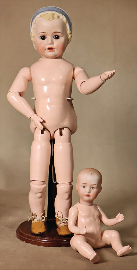 2 dolls, 1x JDK, bisque porcelain crank full head, modelled porcelain hood, fix inset brown glass: 2 dolls, 1x JDK, bisque porcelain crank full head, modelled porcelain hood, fix inset brown glass eyes, opened mouth, 2 upper teeth, tongue, old jointed body is strongly over painted, marking in the h