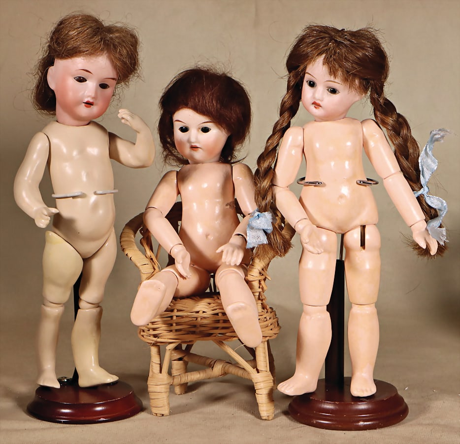 3 dolls, bisque porcelain socket heads, 1x marked N.XOPA R., fix inset brown glass eyes,: 3 dolls, bisque porcelain socket heads, 1x marked N.XOPA R., fix inset brown glass eyes, opened mouth, line of upper teeth, jointed mass body was strongly over painted, undressed, 22 cm, with bi