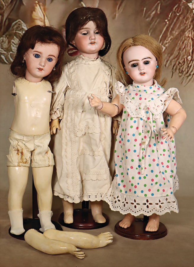 3 dolls, among it SFBJ, mark in the neck DEPOSE SFBJ No. 6, blue sleepy eyes, opened mouth, line of: 3 dolls, among it SFBJ, mark in the neck DEPOSE SFBJ No. 6, blue sleepy eyes, opened mouth, line of upper teeth, pierced ears, 39 cm, jointed body, hands were over painted, wig and clothes are more re
