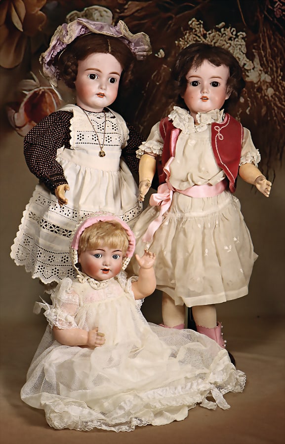 3 pieces, bisque porcelain head dolls, marked 192, 54 cm, brown sleepy eyes, opened mouth, upper: 3 pieces, bisque porcelain head dolls, marked 192, 54 cm, brown sleepy eyes, opened mouth, upper teeth, pierced ears, jointed body, real hair wig, K&R 126, 35 cm, socket head, blue impish eyes, op