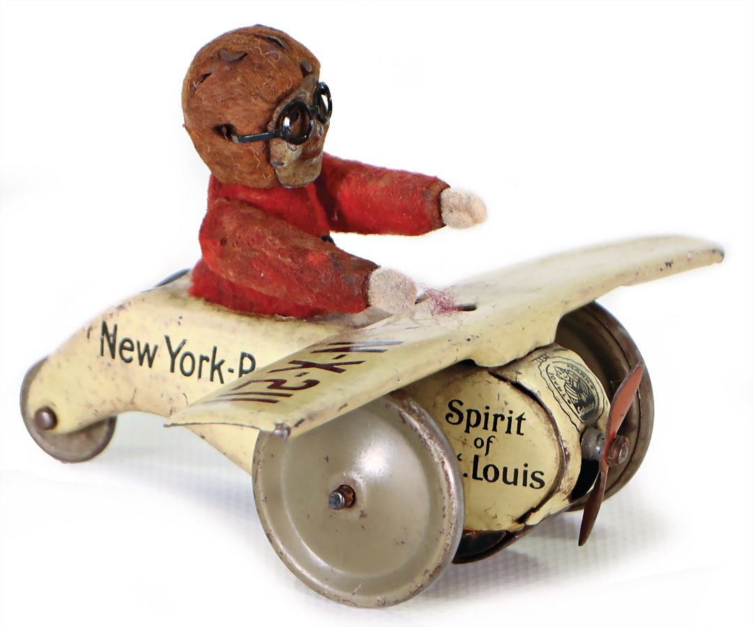 SCHUCO plane NX211 New York Paris Spirit of St. Louis, lithographed sheet metal, with figure, metal, (1 of 2)