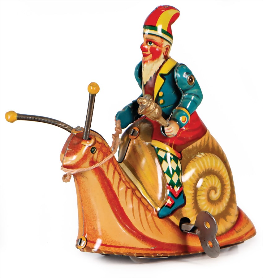 BLÖHMER & SCHÜLER dwarf on a snail, lithographed sheet metal, US zone, height: 12 cm,: BLÖHMER & SCHÜLER dwarf on a snail, lithographed sheet metal, US zone, height: 12 cm, clock mechanism is intact, bell is intact, very good condition German Description BLÖHMER & SCH