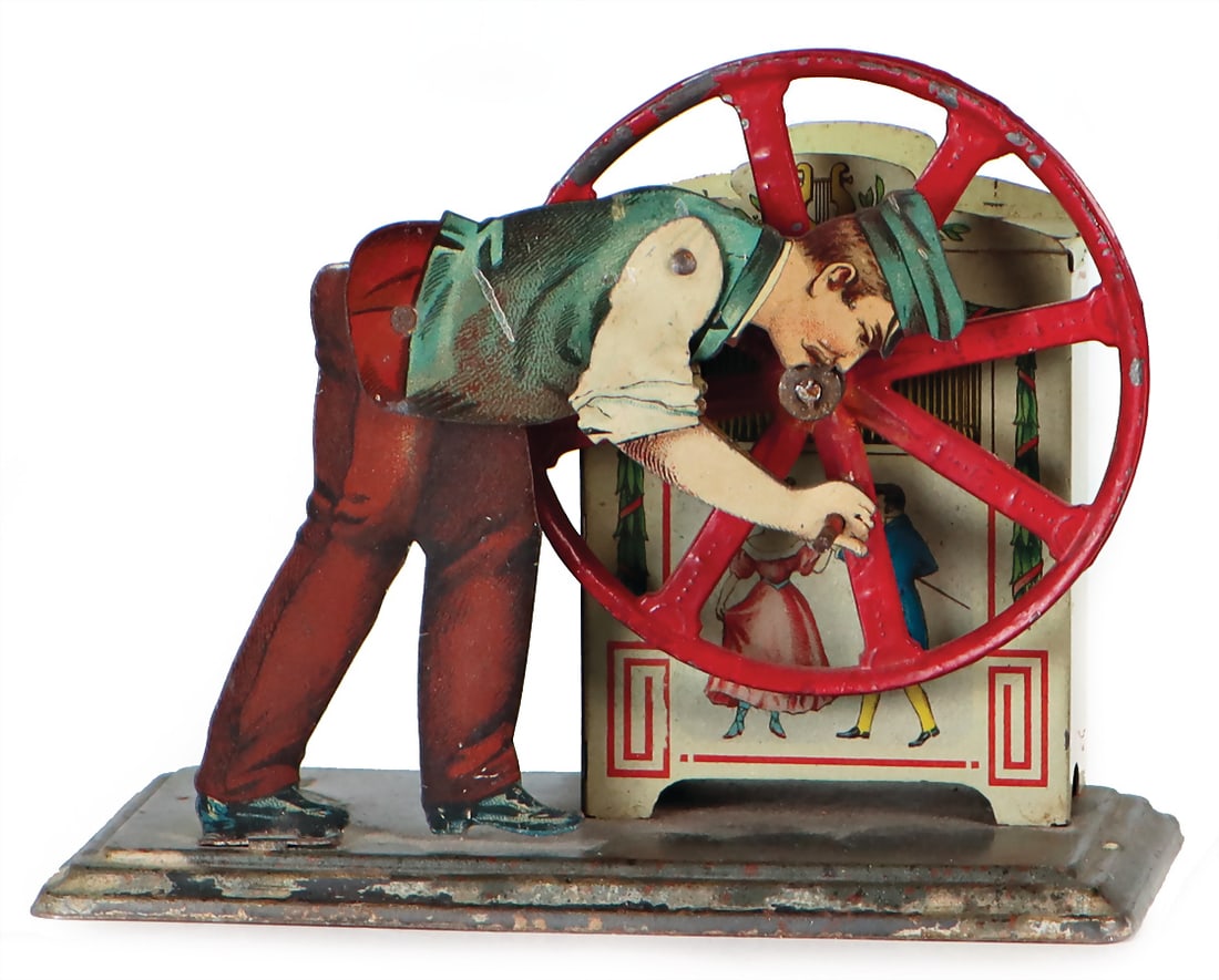 BING drive model, man at barrel organ, lithographed sheet metal, slightly worn, good condition,: BING drive model, man at barrel organ, lithographed sheet metal, slightly worn, good condition, 12,5cm German Description BING Antriebsmodell, Mann an Drehorgel, Blech lithogr., leicht bespielt, guter