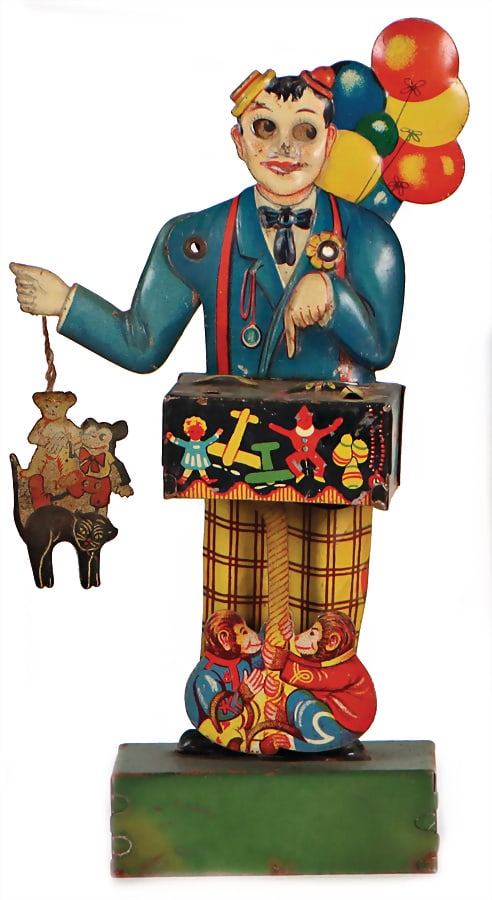 fair seller, lithographed sheet metal, pre-war era, 17 cm, toy with Mickey Mouse is loose enclosed, (1 of 2)