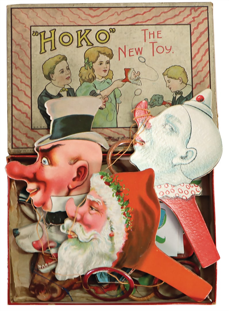 Tire catching game with caricature pictures, England, Hoko the new toy around 1910, in original: Tire catching game with caricature pictures, England, Hoko the new toy around 1910, in original cardboard box, cart. side flaps somewhat torn German Description Reifen-Fangspiel mit Karikaturbildern, 