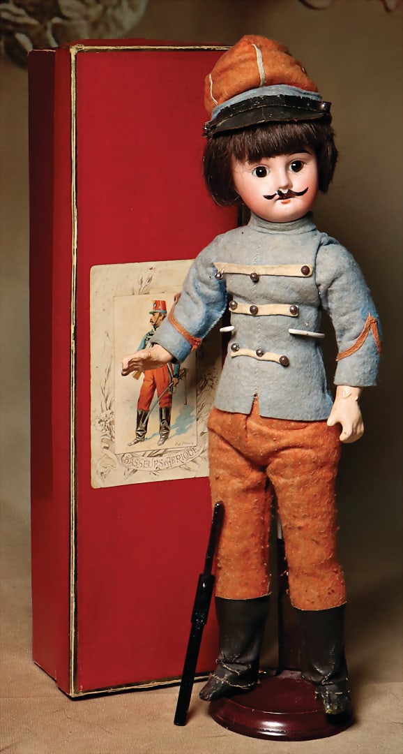 Franz. Soldier, bisque porcelain cranked head, blue pupil-less, fix inset. eyes, off. mouth, row of: Franz. Soldier, bisque porcelain cranked head, blue pupil-less, fix inset. eyes, off. mouth, row of teeth on top, painted moustache, painted 8-0, standing mass body, movable arms and legs, 30 cm, felt