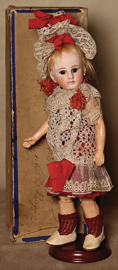 A small German bisque porcelain movable head doll, probably Simon & Halbig for the French: A small German bisque porcelain movable head doll, probably Simon & Halbig for the French market...., brown fixed glass eyes, closed mouth, pierced ears, right earring broken out, jointed body, jointe