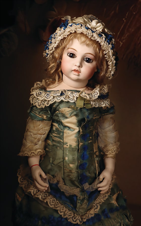 BRU JNE Expressive French bébé from the house of Leon Casimir Bru, Circle Dot Bru with: BRU JNE Expressive French bébé from the house of Leon Casimir Bru, Circle Dot Bru with rare teeth, porcelain movable head, on bisque porcelain breastplate edged with leather Marking: no. 7,