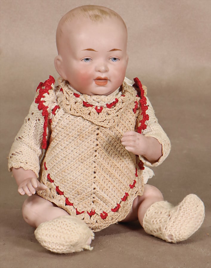 Full-bodied bisque baby, blue painted eyes, open/closed mouth, probably glaze line above the cheek,: Full-bodied bisque baby, blue painted eyes, open/closed mouth, probably glaze line above the cheek, porcelain arms and legs, 21 cm German Description Ganzbiskuit-Baby, blaue gemalte Augen, off./geschl