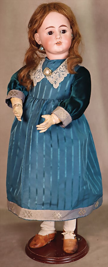 Porcelain head doll, 67 cm, crank head, brown sleeping eyes, off. mouth, pierced ears, dimpled chin,: Porcelain head doll, 67 cm, crank head, brown sleeping eyes, off. mouth, pierced ears, dimpled chin, jointed body, clothes sewn from old fabrics, real hair wig, "Toy Museum Graz" German Description Po
