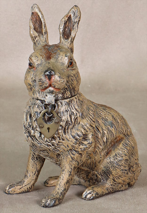 Money box, cast metal, rabbit, 13 cm, glass eyes, with lock, without key, good condition.   German (1 of 2)