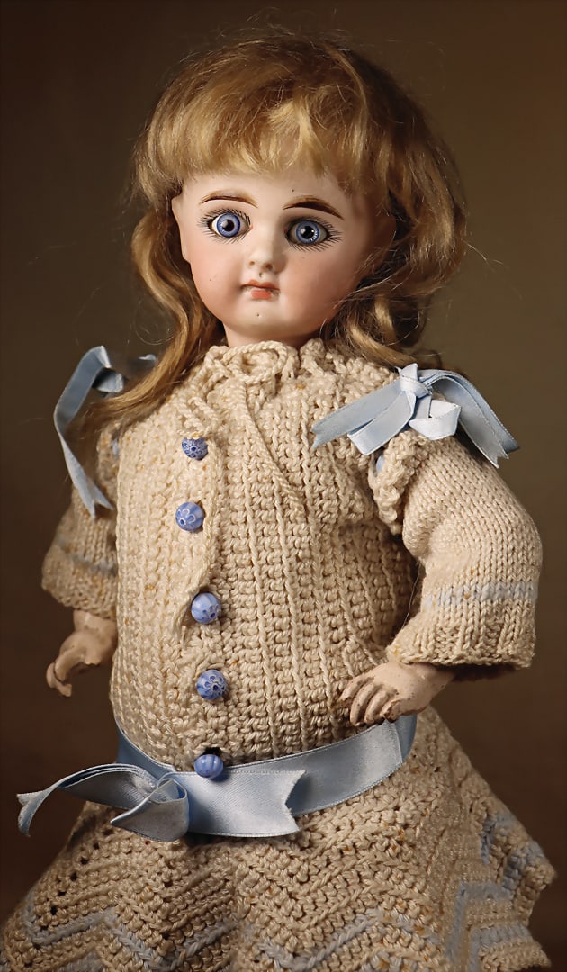 Unknown maker, c. 1885, bisque porcelain head, inset blue glass eyes with spiral threads, closed: Unknown maker, c. 1885, bisque porcelain head, inset blue glass eyes with spiral threads, closed mouth with shaded and contoured lips, pierced ears, German composition and wooden body, fully articulat