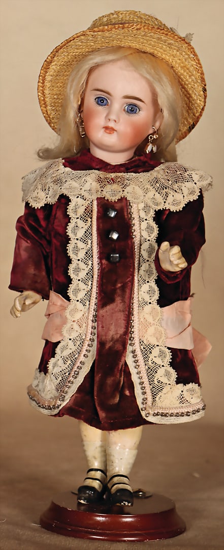 Small German porcelain head doll, full head, fixed blue glass eyes, closed mouth, pierced ears, (1 of 4)