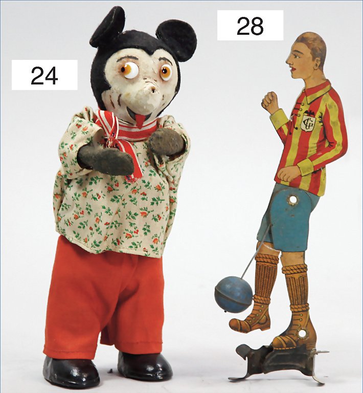 soccer player, lithographed tin, German, 17 cm, the: soccer player, lithographed tin, German, 17 cm, the function stucks a bit, lithography in good condition, used German Description Fußballspieler, Blech lithogr., deutsch, 17 cm, Funktion hakt ein wen