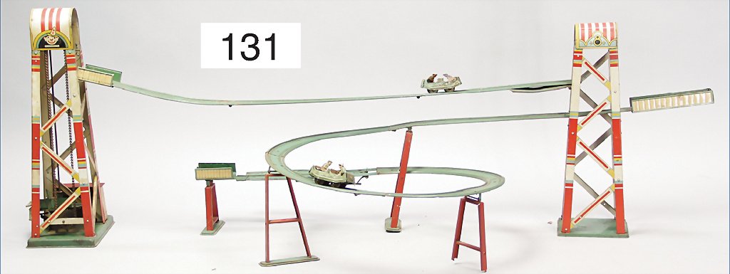 roller coaster, lithographed tin, 2 gondolas, clock: roller coaster, lithographed tin, 2 gondolas, clock mechanism is sluggish, used, the scratches on the paintwork are caused of old age, 1.14 m German Description GÖSO Achterbahn, Blech lithogr., 2 Gon