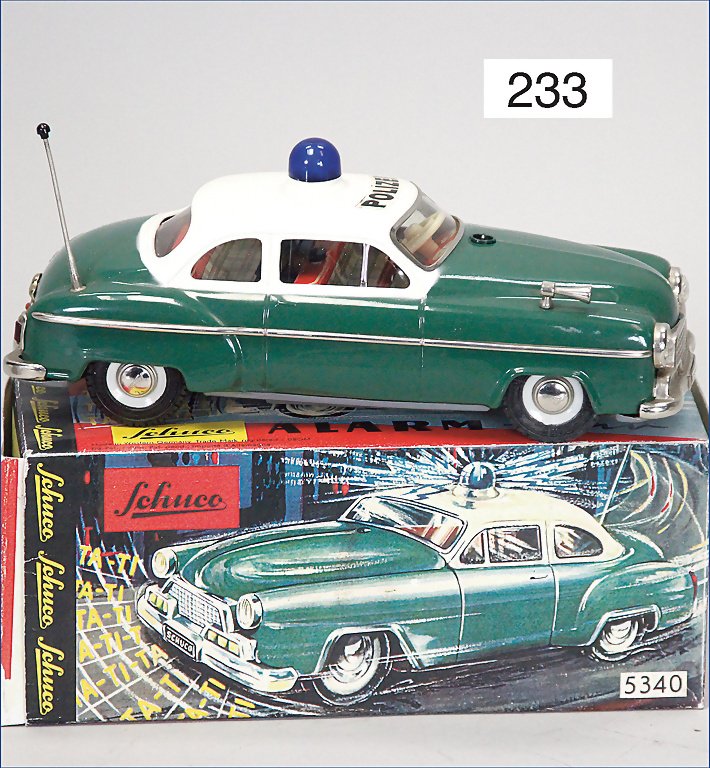 SCHUCO, 5340, Alarmcar, police cars, 2-colored, 21.5: SCHUCO, 5340, Alarmcar, police cars, 2-colored, 21.5 cm, tin, as good as new, battery-operated German Description SCHUCO 5340, Alarmcar, Polizeiwagen, 2-farbig, 21,5 cm, Blech, neuwertig, Batterieantr