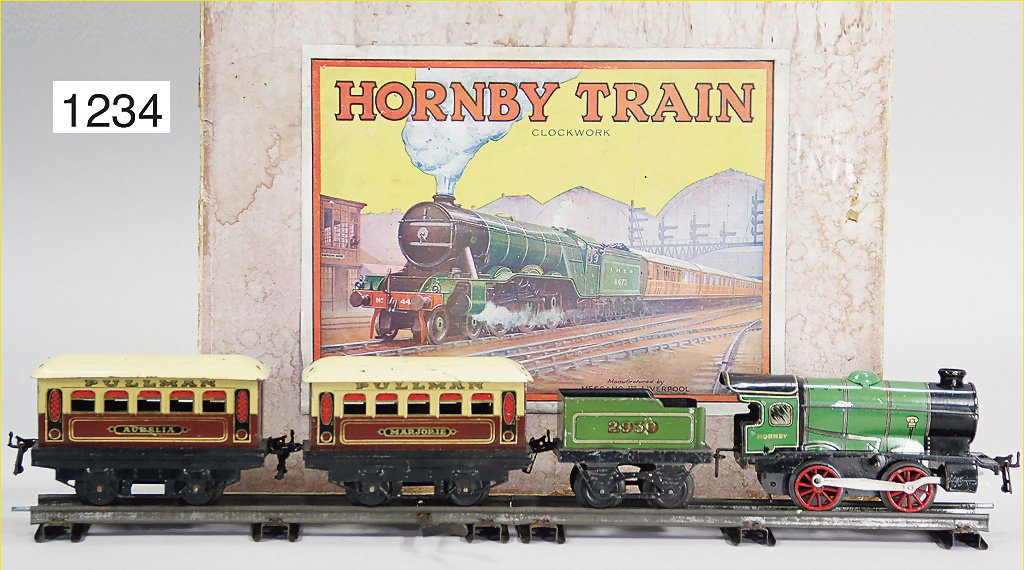 HONRBY train packet, track 0, steam locomotive with: HONRBY train packet, track 0, steam locomotive with separate tender B, clock mechanism is intact, 2 Pullmann-carriage, 2-axled, track material, original box, all in all used, good, box is a little bit