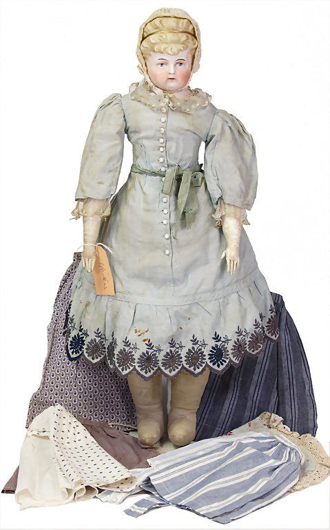 doll, with 2 enameled porcelain breast heads, 1860 -: doll, with 2 enameled porcelain breast heads, 1860 - 1870, 165 x 135 x 86 mm, with extensive wardrobe, from 1840, in different condition, body is worn, 1 head is only partially available, the mounted