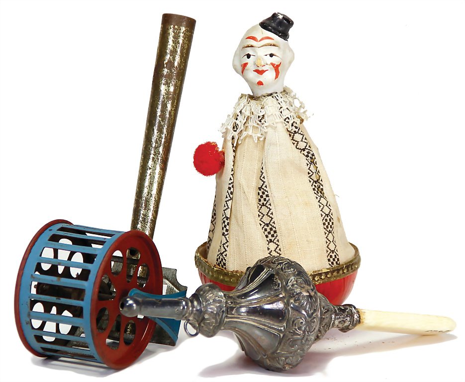 3 pieces, 1 x tumbler clown, papier mâché, 1890 - 1900,: 3 pieces, 1 x tumbler clown, papier mâché, 1890 - 1900, 100 mm, 1 x pipe with squirrel in turnable cage, sheet metal, around 1920, 55 x 115 x 40 mm, 1 x rattle with whistle, 1860 - 1880, 125 mm, ivo