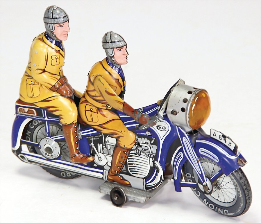 KELLERMANN CKO A 643 motorbike with pillion rider/seat,: KELLERMANN CKO A 643 motorbike with pillion rider/seat, pre-war era, lithographed sheet metal, clock mechanism is intact, 1 arm is missing, otherwise good up to very good condition, 19.5 cm German Des
