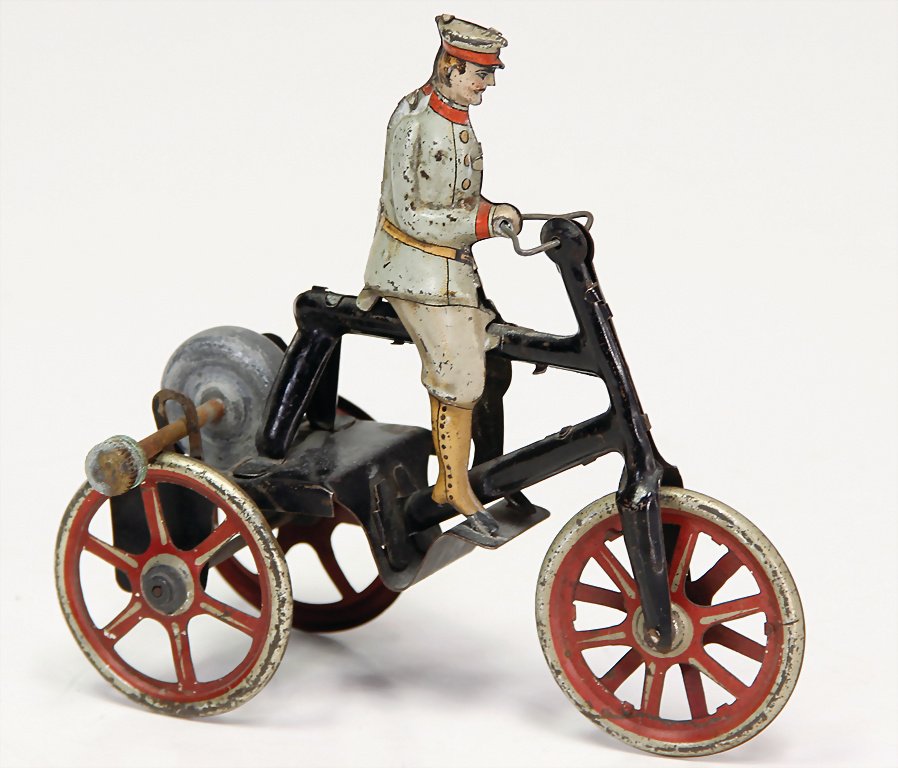 probably KARL BUB tricycle driver, lithographed sheet: probably KARL BUB tricycle driver, lithographed sheet metal, heigth : 12 cm, handlebar is probably original, c. 1910 German Description wohl KARL BUB Dreiradfahrer, Blech lithogr., H: 12 cm, Lenkstang