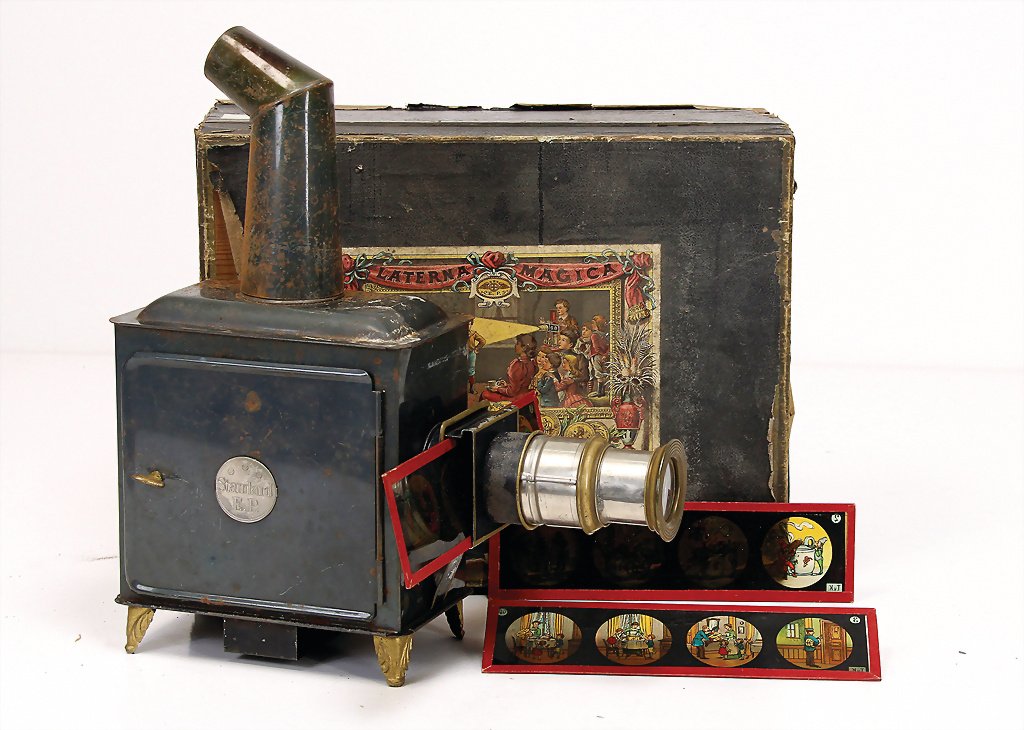 ERNST PLANK Laterna Magica, sheet metal, with chimney: ERNST PLANK Laterna Magica, sheet metal, with chimney burner, 11 sheets of glasses, in original box, with multicolored lithographed cover picture German Description ERNST PLANK Laterna Magica, Blech,