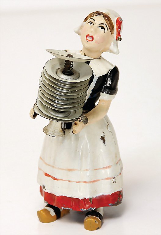 MARTIN lady with plates, handpainted sheet metal, 17: MARTIN lady with plates, handpainted sheet metal, 17 cm, 1 soldered joint was later soldered, partially colorwise retouched, clock mechanism is intact German Description MARTIN Dame mit Tellern, Blech