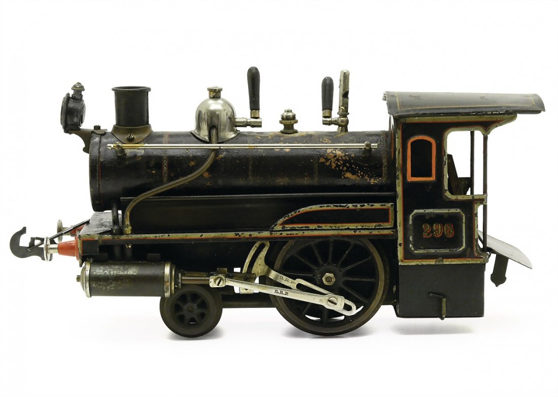 Carette & Cie., Georges steam engine, marked: Carette &amp; Cie., Georges steam engine, marked "296", "D.R.P.", handpainted sheet metal, around 1910, 135 x 270 x 85 mm, good condition, with scratch on the paintwork, boiler