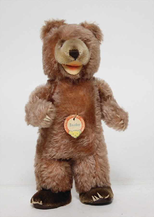 STEIFF Zooby, with button and chest label, chest label: STEIFF Zooby, with button and chest label, chest label is creased, 26 cm, a bit dirty, otherwise good German Description STEIFF Zooby, mit Knopf u. Schild, Schild geknickt, 26 cm, ein wenig verschmutz