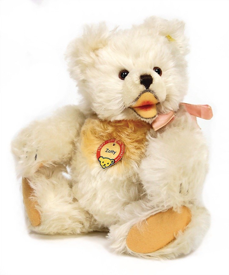 STEIFF Zotty, white, with button, chest label and cloth: STEIFF Zotty, white, with button, chest label and cloth tag label, number is no more readable, cloth tag label is torn, nice full mohair, felt paws are untouched, 27 cm German Description STEIFF Zotty