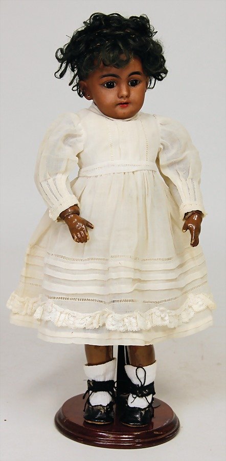 SIMON & HALBIG doll with porcelain head, marked: SIMON &amp; HALBIG doll with porcelain head, marked 1009, dark squirted porcelain, brown fix inset glass eyes, opened mouth, teeth, pierced ears, real hair wig with slight hairloss, on a jointed m