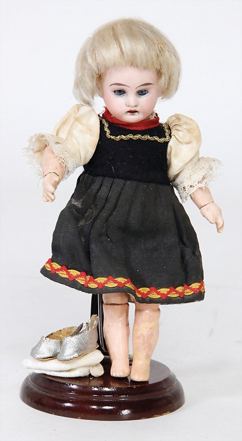 ARMAND MARSEILLES doll with porcelain head, marked: ARMAND MARSEILLES doll with porcelain head, marked 1894, blue sleepy eyes, opened mouth, teeth, mohair wig, on a jointed mass body, left leg and fingertips are over painted resp. fingertips of the lef
