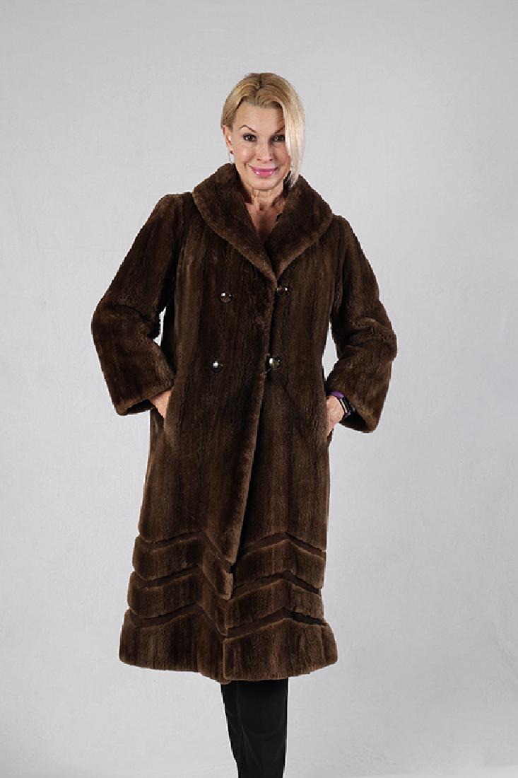 NUTRIA 3/4 LENGTH / FULL LENGTH COAT: NUTRIA 3/4 LENGTH / FULL LENGTH COAT: Natural Nutria Brown Designer Coat with chevron patterned suede inset with a design at the bottom. 4 buttons, shawl collar, fully lined. Purehead and Gunther Fur.
