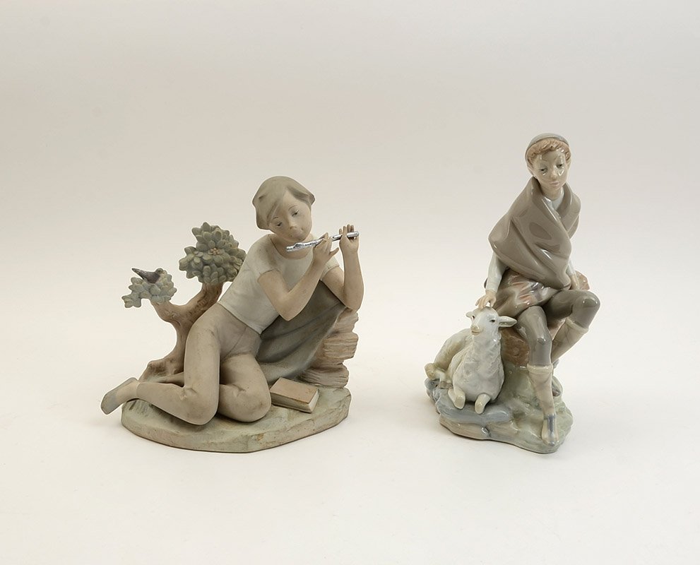 2 LLADRO PORCELAIN FIGURINES: 2 LLADRO PORCELAIN FIGURINES: 2 pieces total to include 1) "Student Flute Player", matte finish, retired 1983, 7 3/4" h. x 8 1/4". 2) "Little Shepherd With Goat", retired 1982, 9 1/2" h. x5 1/2".