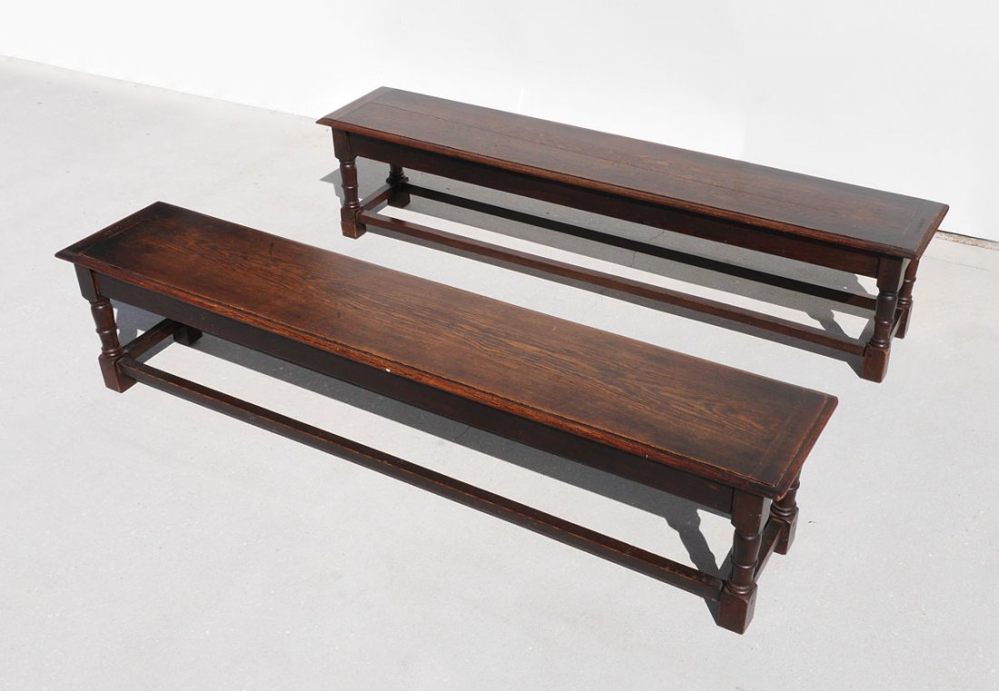PAIR OAK COLLEGE STORAGE BENCHES: PAIR OAK COLLEGE STORAGE BENCHES: Early 20th century, hinged lift tops reveal 2 storage compartments, tops stamped Stookey at each end, turned legs, 19 1/4" h. x 84" x 16".